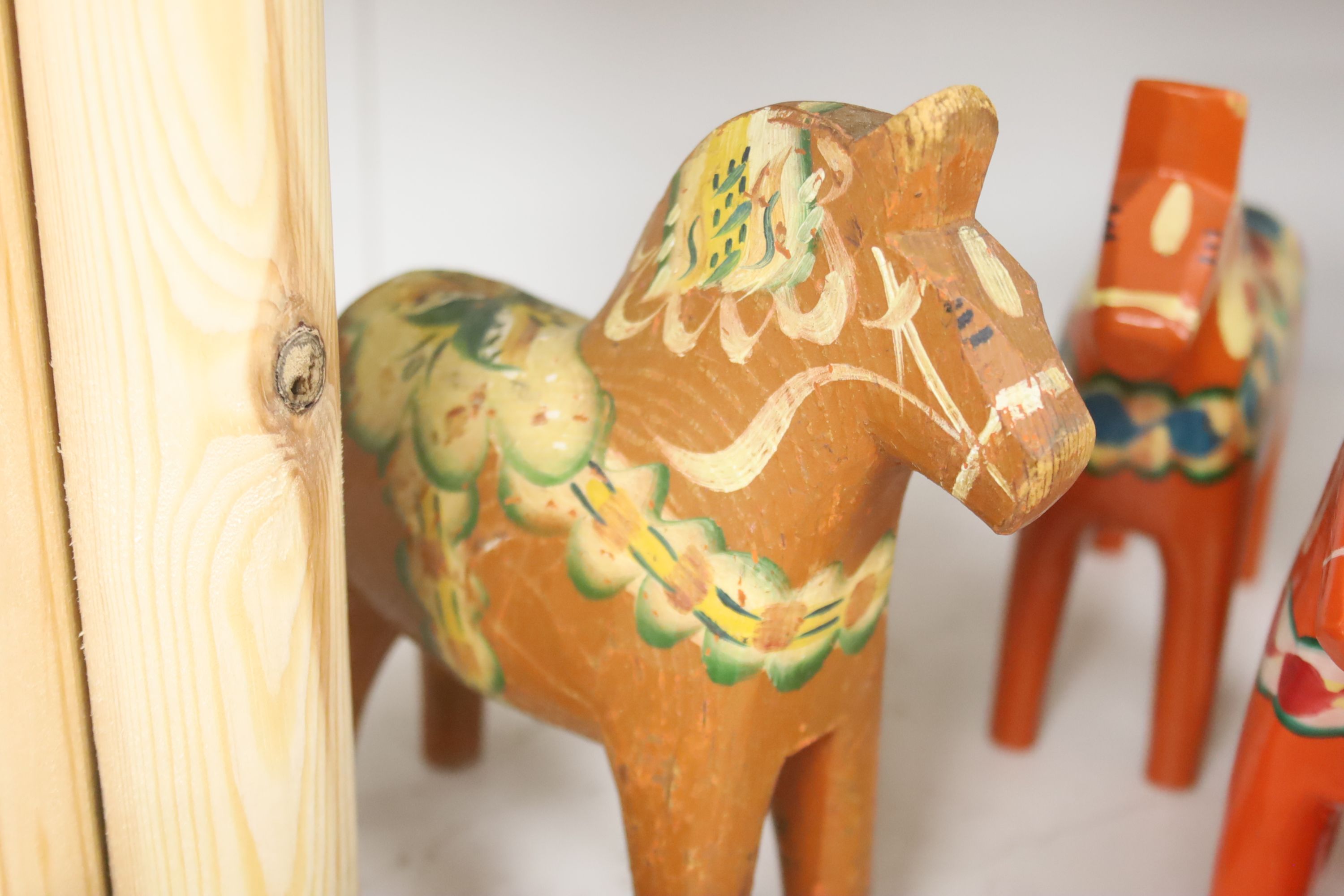 Ten Swedish painted wood Folk Art horses, some by Akta